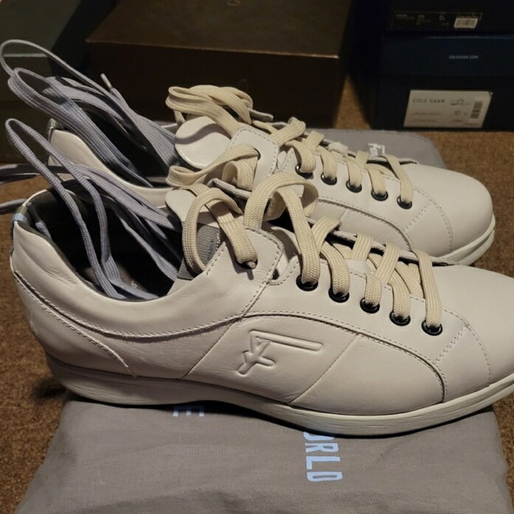 Salvatore Ferragamo off white sneakers. Extra shoe laces and dust bag included.